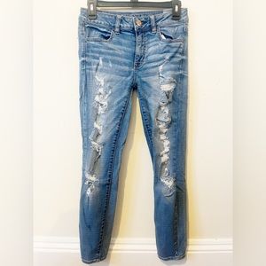 American Eagle Heavily Distressed Super Stretch Mid Rise Jegging Skinny Jeans